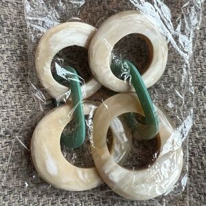 Noonday earrings made of buffalo horn.